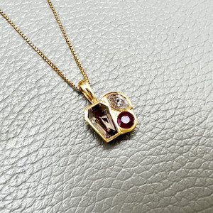 Tanzanite ruby and diamond pendant necklace 14kt yellow gold front view