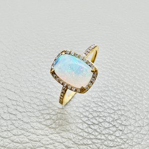 Cushion opal diamond halo ring in 14kt yellow gold