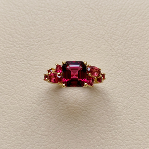 Garnet cocktail ring with rubies and red spinel, 2.66tcw asscher cut garnet center in 14kt yellow gold, top view