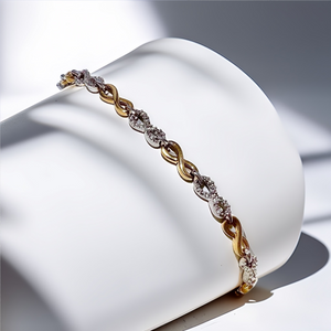 Close-up of diamond-set infinity motif on gold bracelet Close-up of diamond-set infinity motif on gold bracelet