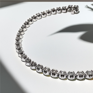 Close-up of natural diamonds totaling 2.00 tcw in tennis bracelet setting Close-up of natural diamonds totaling 2.00 tcw in tennis bracelet setting