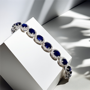 close-up of oval-cut sapphire and diamond accents gemstone bracelet close-up of oval-cut sapphire and diamond accents gemstone bracelet