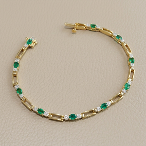 Oval emerald and diamond tennis bracelet 2.16tcw 14kt yellow gold front view