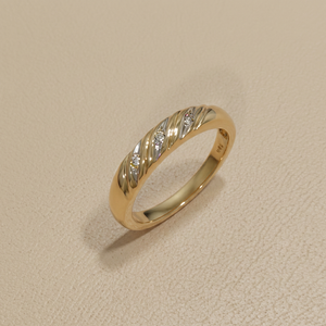 Diamond accent wedding band 4mm 14K yellow gold angle view