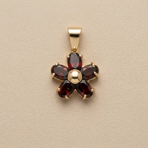 Garnet flower pendant necklace 14kt yellow gold front view