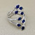 Exquisite Pear-Cut Sapphire Ring with 0.16ct Round Diamonds in White Gold.