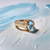 Exquisite Trillion Blue Topaz Diamond Ring in a Rich Yellow Gold Setting
