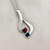 Treasured & Co. 14kt white gold heart necklace adorned with blue topaz and garnet gemstones totaling 0.60tcw.
