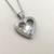 Diamond heart pendant necklace featuring 0.43tcw moving diamonds, elegantly set in 14kt white gold for a unique and dazzling design Treasured & Co.