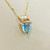 Treasured & Co. 14kt gold necklace showcasing a 2.08tcw trillion-cut blue topaz pendant, perfect for a bold and elegant look.