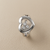 14k white gold diamond heart ring top view showing moving center diamond