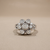 Flower diamond ring flat front view, 0.62tcw cluster bezel set in 14kt white gold