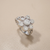 Bezel flower diamond ring, 0.62tcw natural diamonds in 14kt white gold floral cluster, angle view