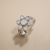 Diamond floral cluster ring in 14kt white gold, front view showing full bezel flower setting