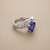 Tanzanite and diamond halo ring 14kt white gold profile detail
