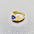 Elegant 0.41tcw trillion tanzanite ring, set in 14kt yellow gold, a striking and unique piece designed for both men and women Treasured And Co.