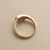 Yellow gold tanzanite ring with trillion centre stone close-up