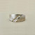 0.10tcw diamond band in 14kt white gold with a diamond-cut finish, designed for men who want a distinctive wedding band or statement ring Treasured & Co.
