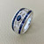 14kt white gold sapphire diamond ring with 0.90tcw, crafted with an oval sapphire center, baguette channel-set sapphires, and round diamonds, designed as a unique vintage piece for women Treasured & Co.