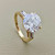 Elegant 3-stone gold fashion ring 4.62ct with round and tapered baguette zirconias, crafted in 14kt yellow gold. A unique engagement or statement ring for women by Treasured & Co., Astoria.