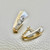 0.76tcw two-tone earrings zirconia, featuring lever back design in 14kt white and yellow gold. A unique zirconia earring set from Treasured & Co.