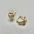 Treasured & Co. fashion gold zirconia earrings 0.60tcw, featuring unique hoop design with 11mm inner diameter, crafted in 14kt rose, white, and yellow gold. A perfect statement piece.