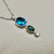Elegant blue topaz, green apatite, and diamond drop necklace 7.25tcw, crafted in 14kt white gold. A one of a kind multi-stone statement necklace for women by Treasured & Co., Astoria.