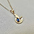 Beautiful wave pendant necklace 0.35-0.56tcw, featuring a Madagascar sapphire or cabochon opal set in 14kt yellow gold. A unique swirl design, perfect for any occasion by Treasured & Co., Astoria.