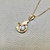 Stunning wave pendant necklace 0.35-0.56tcw, set in 14kt yellow gold with an oval Madagascar sapphire or cabochon opal. A sophisticated and one of a kind design by Treasured & Co., Astoria, New York.