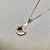 Stunning wave pendant necklace 0.35-0.56tcw, set in 14kt yellow gold with an oval Madagascar sapphire or cabochon opal. A sophisticated and one of a kind design by Treasured & Co., Astoria, New York.