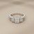 0.76tcw round-cut diamond engagement ring in with baguettes setting — on-hand modeled view
