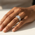 0.76tcw round-cut diamond engagement ring in with baguettes setting — three-quarter angle