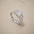 0.76tcw round-cut diamond engagement ring in with baguettes setting — three-quarter angle (2)