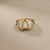Baguette diamond ring 1.03ct with tapered baguettes and flush-set tourmaline, front view