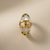 Diamond ring with baguettes and teal tourmaline accents, 18kt yellow gold top view