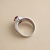 Oval ruby engagement ring, 14kt white gold halo setting, gallery under-stone view