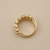 Cluster diamond ring prong setting detail, round brilliant natural diamonds in 14kt yellow gold