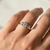 0.77tcw round-cut diamond engagement ring in three-stone setting in two-tone gold — top view