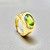 Modern bezel-set peridot ring Modern bezel-set peridot ring