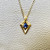 Minimalist Design 14kt Gold Knife Edge Pendant with a Dazzling Sapphire Accent Minimalist Design 14kt Gold Knife Edge Pendant with a Dazzling Sapphire Accent