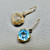 Swiss blue topaz gold earrings hexagonal 12.50ct close-up blue diamond white diamond
