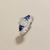 1.70tcw oval-cut sapphire engagement ring in three-stone setting — three-quarter angle