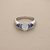 1.70tcw oval-cut sapphire engagement ring in three-stone setting — on-hand modeled view