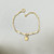 Tri-color 14kt gold padlock and chain bracelet detail