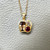 Warm-toned tanzanite center with ruby and diamond accents 14kt yellow gold