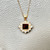 Treasured And Co. garnet And diamond halo pendant necklace