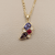 Close-up of Zoisite, Red Spinel, and Diamond pendant