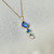 Tanzanite blue topaz pendant on 18 inch cable chain 14kt yellow gold