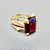 Rhodolite garnet ring ruby accents flat view 14kt yellow gold 11.46ct