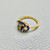 Side view of bi color tourmaline ring showcasing sapphire details Side view of bi color tourmaline ring showcasing sapphire details